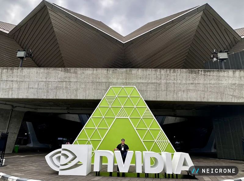 The NVIDIA sign and green triangular installation outside the venue