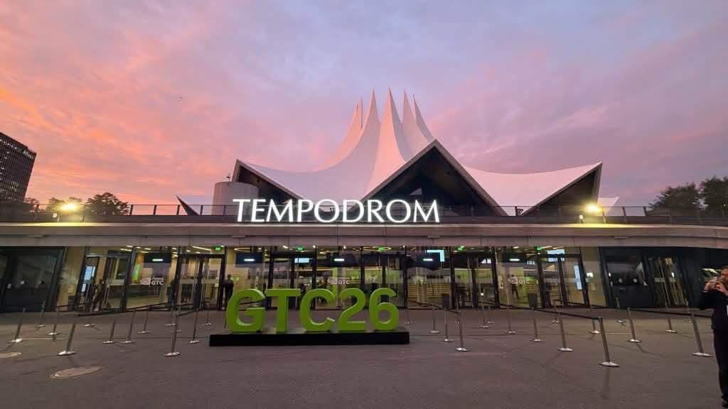 The Tempodrom in Berlin at dusk, with the green GTC26 letters in front of the entrance