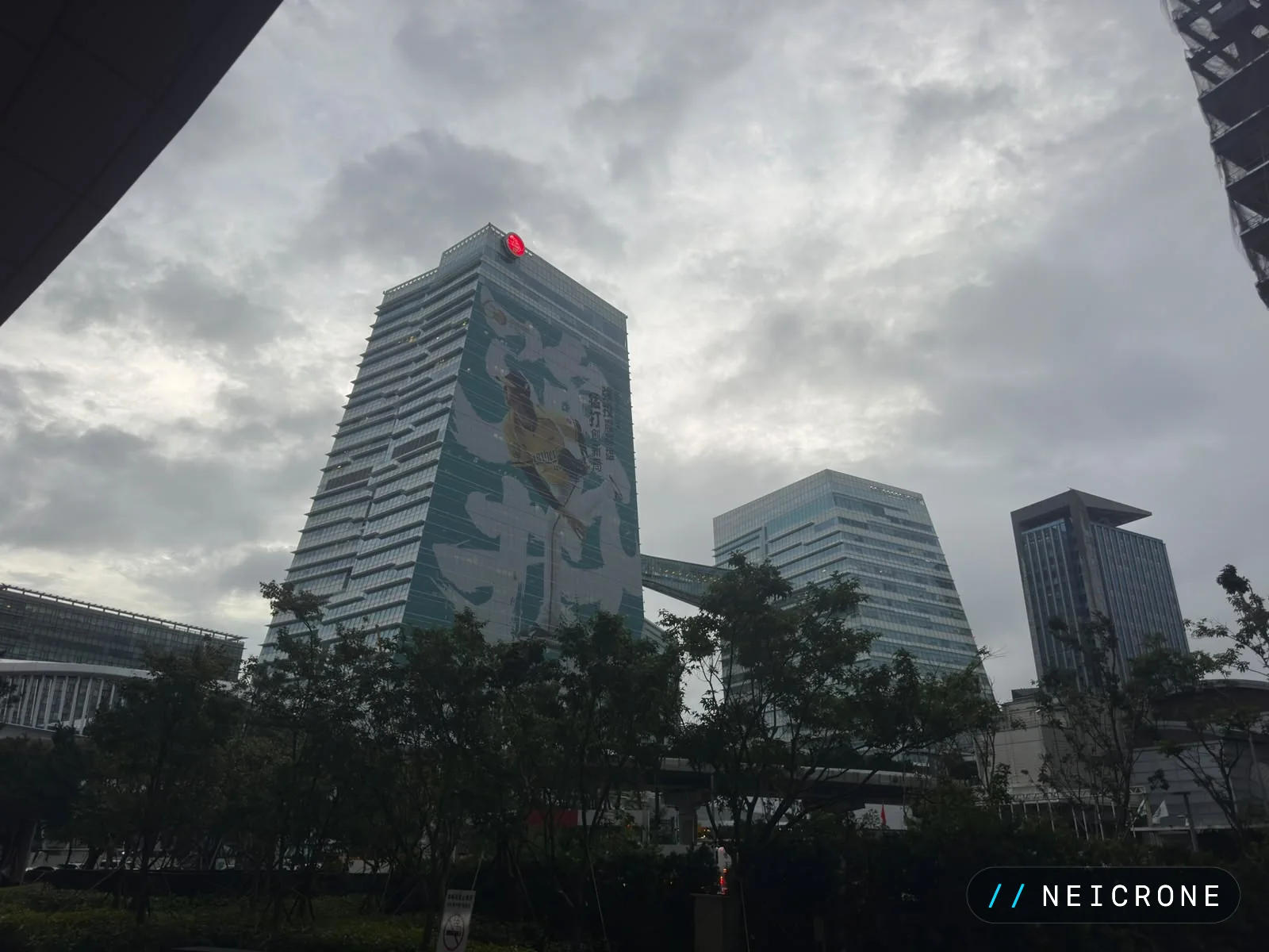 Office towers in Taipei under an overcast sky