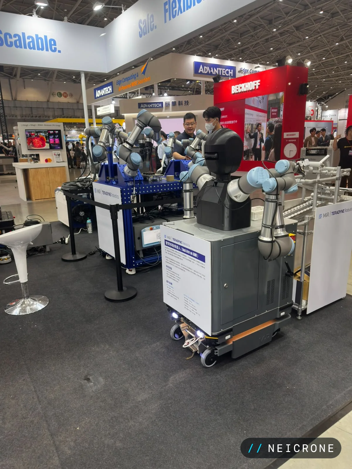 Teradyne Robotics dual-arm robot mounted on an autonomous mobile robot