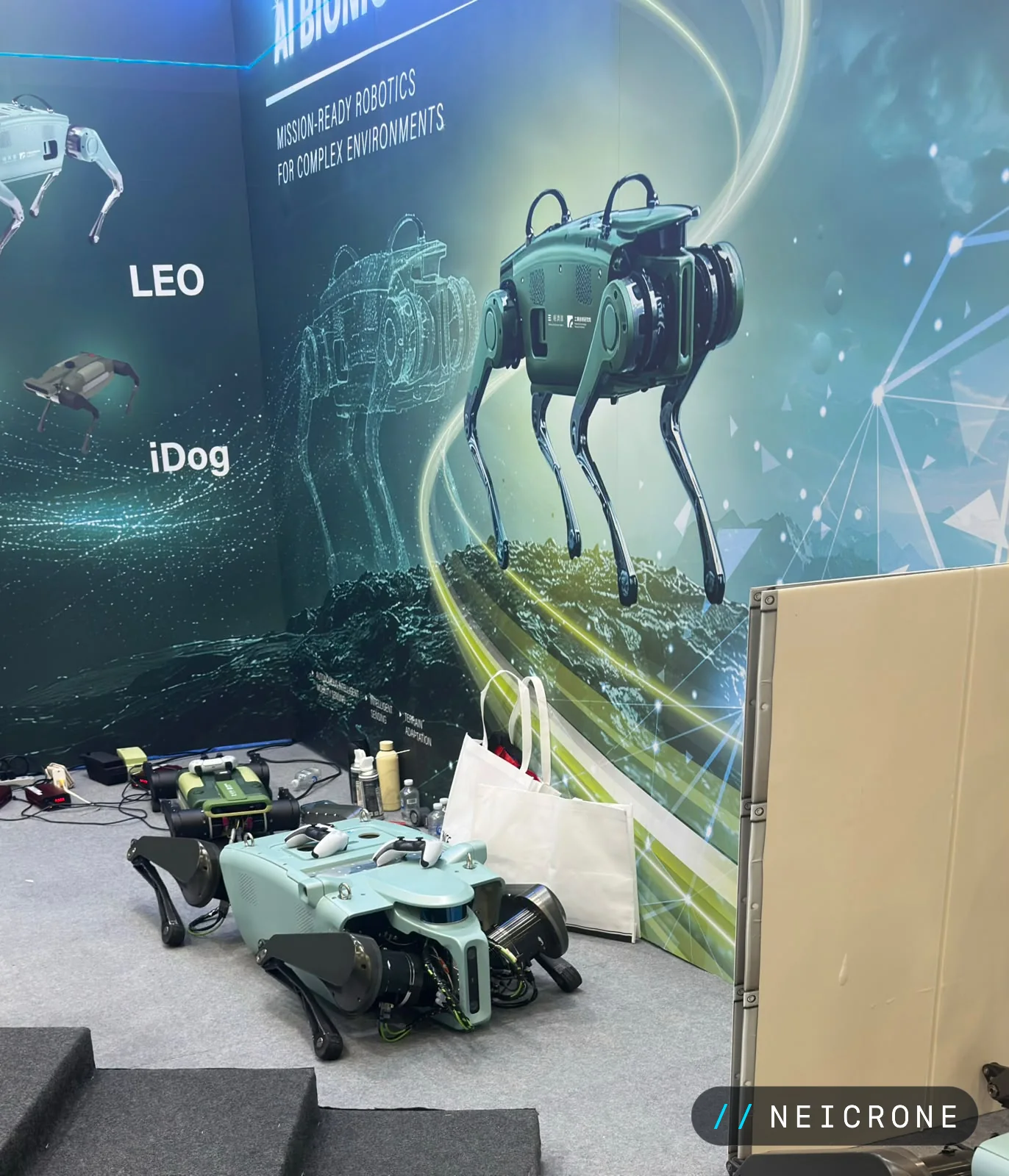 Quadruped robots LEO and iDog on display under a mission-ready robotics banner